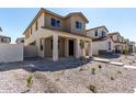 Charming two-story home with a cozy front porch and craftsman architectural details at 15586 S 181St Dr, Goodyear, AZ 85338
