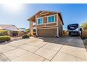 Inviting two-story home featuring desert landscaping, spacious driveway, and RV parking at 17466 N 64Th Ave, Glendale, AZ 85308