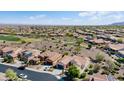 Well-maintained neighborhood featuring single-Gathering homes, desert landscaping, golf course, and tile roofs at 20453 N 264Th Ave, Buckeye, AZ 85396