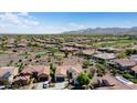 Spacious neighborhood with mountain views, showcasing desert landscaping, tile roofs, and single-Gathering homes at 20453 N 264Th Ave, Buckeye, AZ 85396
