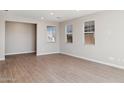 Spacious living room with plenty of natural light from large windows at 21216 N 58Th St, Phoenix, AZ 85054