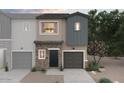 New construction townhome with brick detail, siding, and an attached garage at 2843 W Eagle Talon Rd, Phoenix, AZ 85085