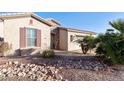 View of the front yard with shuttered window and desert landscaping at 4214 E Donato Dr, Gilbert, AZ 85298