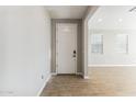 Bright entryway featuring a stylish front door and tile flooring at 5850 E Ringtail Way, Phoenix, AZ 85054