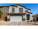 Two-story home boasts a neutral stucco exterior, two-car garage, and well-maintained landscaping at 706 W Green Tree Dr, San Tan Valley, AZ 85143