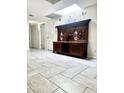 Hallway with skylight and hardwood cabinet at 8302 N 21St Dr # L204, Phoenix, AZ 85021