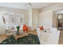 Bright living room with modern furniture, hardwood floors, neutral walls, and many windows at 1024 E Frye Rd # 1063, Phoenix, AZ 85048