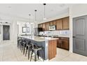 Spacious kitchen island with granite countertop, seating for six, stainless appliances at 1051 W Inca St, Mesa, AZ 85201