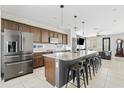 Spacious kitchen island with granite countertop, seating for six and open to the living area at 1051 W Inca St, Mesa, AZ 85201
