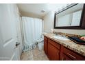 Bathroom featuring a vanity with granite countertop, cabinets, mirror and toilet at 1645 W Baseline Rd # 2026, Mesa, AZ 85202