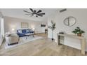 Bright living room boasts modern decor, wood floors, and a stylish ceiling fan at 2604 W Wolf St, Phoenix, AZ 85017
