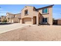 View of the beautiful stucco home with a well maintained driveway and desert landscaping at 28050 N Limestone Ln, San Tan Valley, AZ 85143