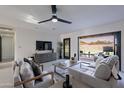 Bright living room with a ceiling fan, sliding glass doors, and comfortable seating at 4809 N 30Th Pl, Phoenix, AZ 85016