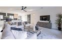 Open concept living room showcasing a modern aesthetic, a ceiling fan, and neutral tones at 4809 N 30Th Pl, Phoenix, AZ 85016