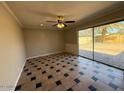Bright living room featuring a sliding glass door to backyard and unique tile floors at 5639 N 46Th Ave, Glendale, AZ 85301