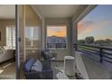 Cozy balcony with chairs offering a scenic neighborhood view at 734 E Doral Ave # 202, Gilbert, AZ 85297