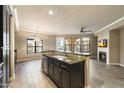 Open-concept kitchen featuring granite countertops, stainless steel appliances, and tile flooring at 7601 E Indian Bend Rd # 2056, Scottsdale, AZ 85250