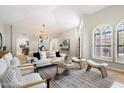 Open-concept living room with modern decor, vaulted ceilings, and natural light at 7955 E Chaparral Rd # 115, Scottsdale, AZ 85250