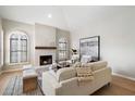 Bright living room featuring arched windows, vaulted ceilings and cozy fireplace at 7955 E Chaparral Rd # 115, Scottsdale, AZ 85250