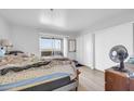 Cozy bedroom with sliding door to a balcony and a neutral color scheme at 12123 W Bell Rd # 315, Surprise, AZ 85378