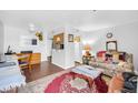 Bright living room with connected dining area and wood flooring throughout at 12123 W Bell Rd # 359, Surprise, AZ 85378