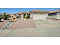 Charming single-story home featuring a desert landscape, walkway and two-car garage at 15412 N 160Th Ln, Surprise, AZ 85374