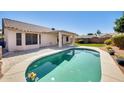 Backyard pool featuring cool water and lush landscaping, ideal for relaxation and outdoor enjoyment at 15412 N 160Th Ln, Surprise, AZ 85374