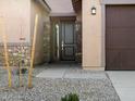 The front door boasts stone pillars, manicured stone landscaping, and a covered porch at 2639 E Santa Ynez Dr, Casa Grande, AZ 85194