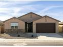 Charming single-story home featuring a well-maintained yard, two-car garage, and neutral color palette at 2639 E Santa Ynez Dr, Casa Grande, AZ 85194