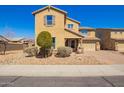Inviting two-story home with desert landscaping, a paver driveway, and a covered entry at 2926 W Thorn Tree Dr, Phoenix, AZ 85085