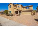 Two-story home featuring a paver driveway, desert landscaping, and a covered entry way at 2926 W Thorn Tree Dr, Phoenix, AZ 85085