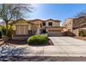 Charming two-story home with stone accents, a well manicured yard, and mature landscaping at 29374 N 125Th Dr, Peoria, AZ 85383