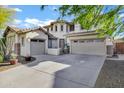 Stunning two-story home with a three-car garage and an inviting front entrance at 29374 N 125Th Dr, Peoria, AZ 85383