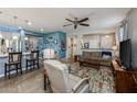 Spacious living area with an open floor plan, neutral tones, and comfortable seating at 40802 W Portis Dr, Maricopa, AZ 85138