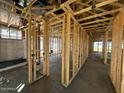 Interior view of a home under construction, showcasing the wood framing and open layout at 4296 E Brook Lynn Pl, San Tan Valley, AZ 85140