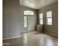 Bright living room featuring tile flooring, arched windows, and neutral paint, creating an open space at 4402 E Creosote Dr, Cave Creek, AZ 85331