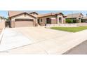Single-Gathering home with a 2-car garage, long driveway, and attractive landscaping at 6920 W Tether Trl, Peoria, AZ 85383