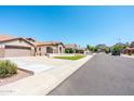 Charming home situated on a well-maintained street with mature landscaping and mountain views at 6920 W Tether Trl, Peoria, AZ 85383