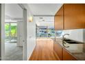 Modern kitchen with hardwood floors, wood cabinets, and stainless steel appliances with lots of natural light at 7137 E Rancho Vista Dr # 6009, Scottsdale, AZ 85251