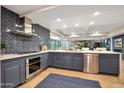 This modern kitchen features stainless steel appliances, a beautiful backsplash and opens into a dining area at 7151 E Rancho Vista Dr # 2006, Scottsdale, AZ 85251
