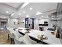 Open concept kitchen features a large island with barstool seating, stainless appliances, and ample natural light at 7151 E Rancho Vista Dr # 2006, Scottsdale, AZ 85251