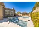 A custom pool and spa with a desert view and blue skies at 7739 E Evening Glow Dr, Scottsdale, AZ 85266