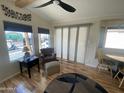 Comfortable living room with wood floors, plenty of natural light and an accent chair at 1118 S Shawnee Dr, Apache Junction, AZ 85119