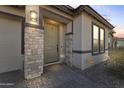 The house features a stone pillar entrance and Vivint home security system at 11607 W Marguerite Ave, Avondale, AZ 85323