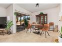 Bright dining area with sliding glass door to patio and a classic china cabinet at 19975 N Crescent Way, Surprise, AZ 85374