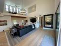 An airy floor plan with a vaulted ceiling, a view of the loft, and a mirror reflecting the kitchen at 3811 N 64Th St, Scottsdale, AZ 85251