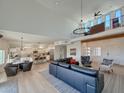 Open-concept living space with high ceilings, a second-story loft, and a modern kitchen at 3811 N 64Th St, Scottsdale, AZ 85251