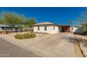Single-story home featuring xeriscaping, a long driveway, and a covered parking area at 4539 N 9Th Ave, Phoenix, AZ 85013