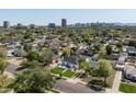 Wide aerial shot capturing the home's neighborhood and surrounding city skyline at 521 W Cambridge Ave, Phoenix, AZ 85003