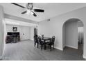 Open dining area with modern lighting, tile floors, and easy access to other living spaces at 5342 S Farmer Ave, Tempe, AZ 85283